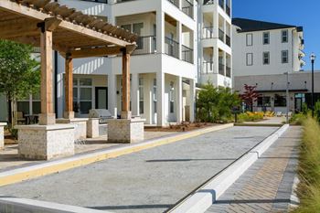 A building with a street and a sidewalk in front of it
